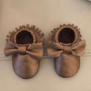 Gold baby moccasins